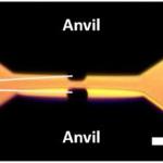 Figure caption: NCD micro-anvils grown on single crystal diamond anvils and mounted in an opposed anvil configuration before pressurization in a diamond anvil cell. The entire diamond anvil including the NCD micro-anvil has been deposited with a one micron thick layer of tungsten metal for pressure measurement by x-ray diffraction.